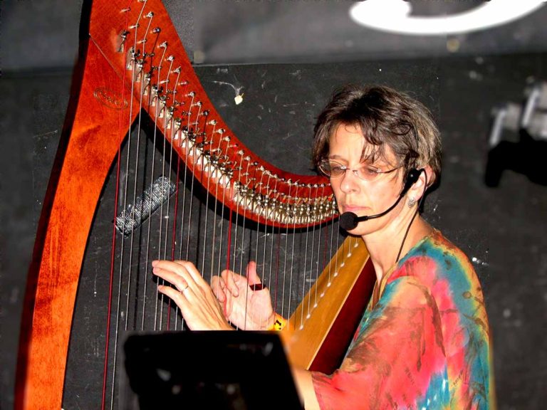 Harp player performing on stage